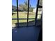 View of the outdoor patio from the enclosed back porch, showcasing the community's manicured green space at 2502 Hidden Cove Dr # 2502, Moncks Corner, SC 29461