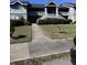 Attractive condominium exterior featuring multiple stories, well-maintained landscaping, and inviting entry stairs at 2502 Hidden Cove Dr # 2502, Moncks Corner, SC 29461