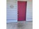 Entry to the home featuring a solid and secure vibrant, pink-painted front door at 2502 Hidden Cove Dr # 2502, Moncks Corner, SC 29461