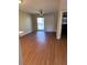Bright and airy living room with sliding glass doors, neutral paint, and laminate flooring at 2502 Hidden Cove Dr # 2502, Moncks Corner, SC 29461