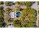 Aerial view of home with swimming pool, spa, lush greenery and mature trees at 2802 Ion Ave, Sullivans Island, SC 29482