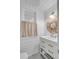 Bathroom featuring white vanity, and a woven mirror above the sink at 2802 Ion Ave, Sullivans Island, SC 29482