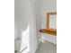 Modern bathroom features patterned tile flooring, a walk-in shower, and a wooden shelf at 2802 Ion Ave, Sullivans Island, SC 29482