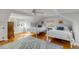 Bright bedroom with hardwood floors, two queen beds, area rug, and large windows at 2802 Ion Ave, Sullivans Island, SC 29482