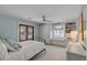 Cozy bedroom with soft blue walls, ample storage, a ceiling fan, and a private entrance to the porch at 2802 Ion Ave, Sullivans Island, SC 29482