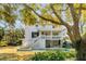 Home exterior with pool, porch and large trees at 2802 Ion Ave, Sullivans Island, SC 29482
