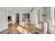 Cozy living area featuring shiplap walls, bar seating, and lots of natural light at 2802 Ion Ave, Sullivans Island, SC 29482