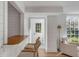 Open-concept living room with shiplap walls, wood floors, and a view of the outdoors at 2802 Ion Ave, Sullivans Island, SC 29482