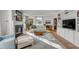 Spacious living room with a fireplace, lots of natural light, and built-in shelving at 2802 Ion Ave, Sullivans Island, SC 29482