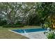 Backyard pool with stone tile surround and mature trees at 2802 Ion Ave, Sullivans Island, SC 29482
