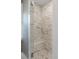 Clean and bright shower with marble tile and a built-in bench at 2802 Ion Ave, Sullivans Island, SC 29482