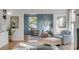 Stylish sitting room featuring light blue walls, lots of windows, and modern decor at 2802 Ion Ave, Sullivans Island, SC 29482