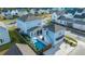 Aerial view of a two-story home with backyard pool, patio, and fenced yard at 282 Great Lawn Dr, Summerville, SC 29486