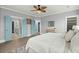 Stylish bedroom boasts blue painted doors, light wood floors, and an airy, relaxing atmosphere at 282 Great Lawn Dr, Summerville, SC 29486