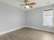 Bedroom with wood floors, neutral paint, a ceiling fan and a window at 282 Great Lawn Dr, Summerville, SC 29486