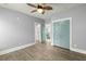 Bedroom with wood floors, doors to a bathroom and a closet, and ceiling fan at 282 Great Lawn Dr, Summerville, SC 29486