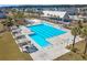 Aerial view of sparkling, large community pool with lap lanes, seating areas, and shaded pergolas at 282 Great Lawn Dr, Summerville, SC 29486
