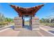 Unique architectural structure frames a view of the green space in a Primary-planned community with bike racks at 282 Great Lawn Dr, Summerville, SC 29486