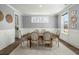 Dining room with seating for six, showcasing a modern aesthetic with a neutral color scheme and ample lighting at 282 Great Lawn Dr, Summerville, SC 29486