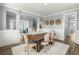 Dining room with seating for six and open view of living space and staircase, perfect for Gathering gatherings at 282 Great Lawn Dr, Summerville, SC 29486
