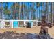Fenced dog park for large and small dogs with a welcome statue and adjacent to a treed area at 282 Great Lawn Dr, Summerville, SC 29486