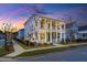 Charming two-story home featuring double porches, mature landscaping, and sidewalk at 282 Great Lawn Dr, Summerville, SC 29486