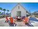 Community fire pit with Adirondack chairs and modern pavilion, offering a cozy outdoor gathering space at 282 Great Lawn Dr, Summerville, SC 29486
