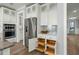 Bright white kitchen with stainless steel refrigerator and organized pull out drawers at 282 Great Lawn Dr, Summerville, SC 29486