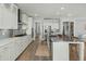 Spacious kitchen featuring a large island, stainless steel appliances and white cabinetry at 282 Great Lawn Dr, Summerville, SC 29486