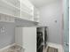 Laundry room with washer, dryer, and overhead shelving for storage at 282 Great Lawn Dr, Summerville, SC 29486