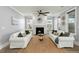 Bright and cozy living room featuring a fireplace and comfortable seating at 282 Great Lawn Dr, Summerville, SC 29486