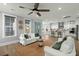 Open-concept living room flows into kitchen for seamless entertaining and gathering at 282 Great Lawn Dr, Summerville, SC 29486