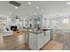 Open-concept kitchen and living room create a seamless and inviting space at 282 Great Lawn Dr, Summerville, SC 29486