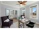 Office with work desk, fan, and plush armchairs, creating an elegant and functional workspace at 282 Great Lawn Dr, Summerville, SC 29486