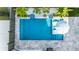 A beautiful overhead view of a private pool with a tanning ledge, in-pool seats, and tropical landscaping at 282 Great Lawn Dr, Summerville, SC 29486