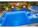 Aerial view of a backyard pool featuring a sun shelf, fountains, and fire bowls at 282 Great Lawn Dr, Summerville, SC 29486