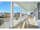 Wide porch offering a serene outdoor living space with views of the neighborhood and clear blue skies at 282 Great Lawn Dr, Summerville, SC 29486