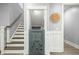 Under-stairs storage with custom access door, blending functionality with unique design elements at 282 Great Lawn Dr, Summerville, SC 29486