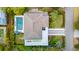 Aerial view of a property showcasing its sprawling layout, pool, and lush landscaping at 3 37Th Ave, Isle of Palms, SC 29451