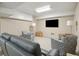 Cozy basement TV room with plush seating, patterned chairs, and ambient lighting at 3 37Th Ave, Isle of Palms, SC 29451