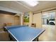 Open basement featuring a ping pong table, foosball table, and a garage entrance at 3 37Th Ave, Isle of Palms, SC 29451