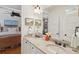 Bathroom with double vanity and neutral granite countertops at 3 37Th Ave, Isle of Palms, SC 29451