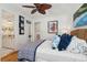 Well lit bedroom featuring a wicker frame bed, hardwood floors, and ceiling fan at 3 37Th Ave, Isle of Palms, SC 29451