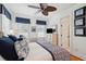 Bright bedroom with ceiling fan, wicker bed frame, tv, and plenty of natural light at 3 37Th Ave, Isle of Palms, SC 29451