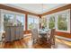Dining room with a modern chandelier and large windows providing ample natural light at 3 37Th Ave, Isle of Palms, SC 29451