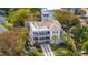 Desirable coastal home with a multi-level deck, rooftop terrace, and beautiful driveway landscaping at 3 37Th Ave, Isle of Palms, SC 29451