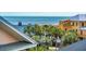 A view of a beach house and a building under construction with the ocean in the background at 3 37Th Ave, Isle of Palms, SC 29451