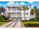 Stunning three-story beach house with multiple balconies, a spiral staircase, and well-manicured landscaping at 3 37Th Ave, Isle of Palms, SC 29451
