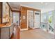Upstairs hallway with hardwood floors, wood paneling, access to bathroom and second floor staircase at 3 37Th Ave, Isle of Palms, SC 29451