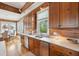 Kitchen with stainless appliances, marble countertop, and a window overlooking the dining area at 3 37Th Ave, Isle of Palms, SC 29451